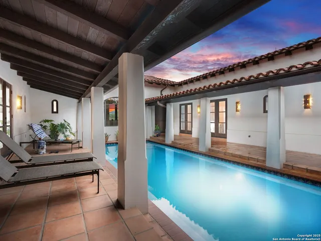 an aerial view of residential house with outdoor space and lake view
