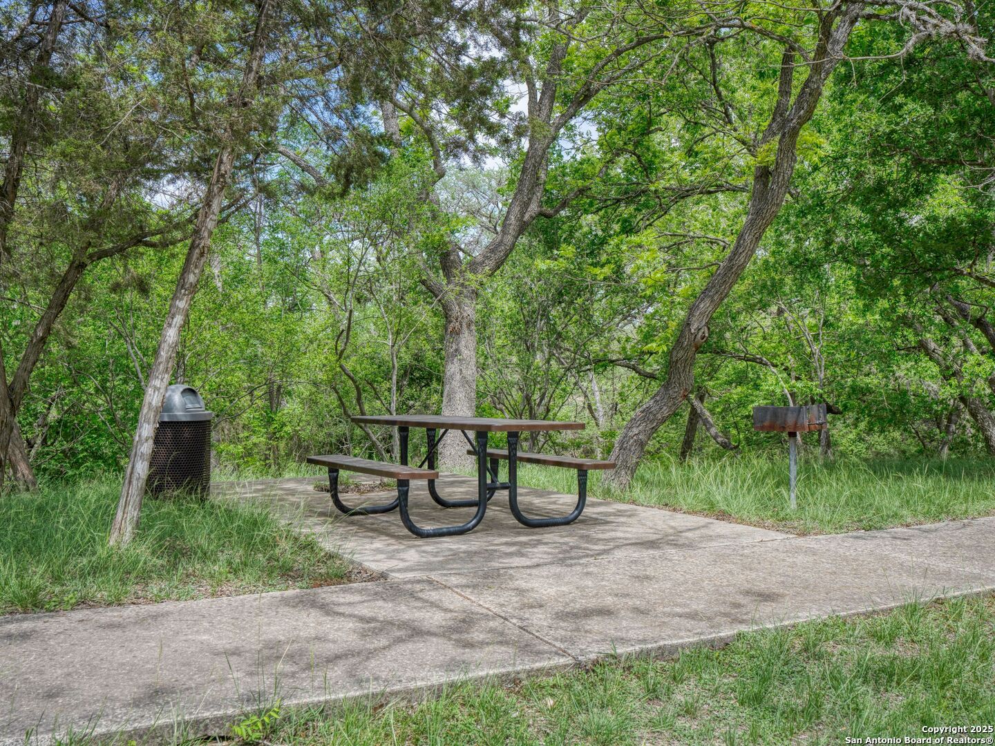 2835 Palomino Springs Bandera, TX 78003 - Photo 62 of 77 a view of a bench in the garden