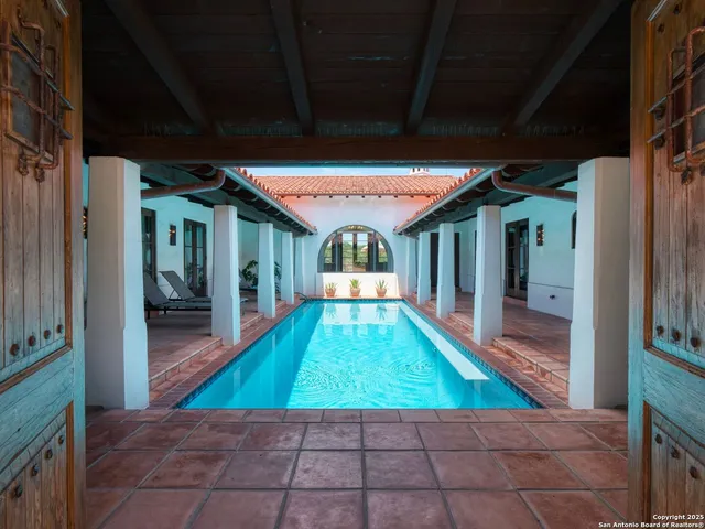 a living room with furniture ceiling fan and a fireplace