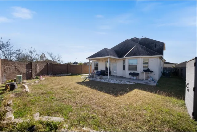 a swimming pool view with a seating space