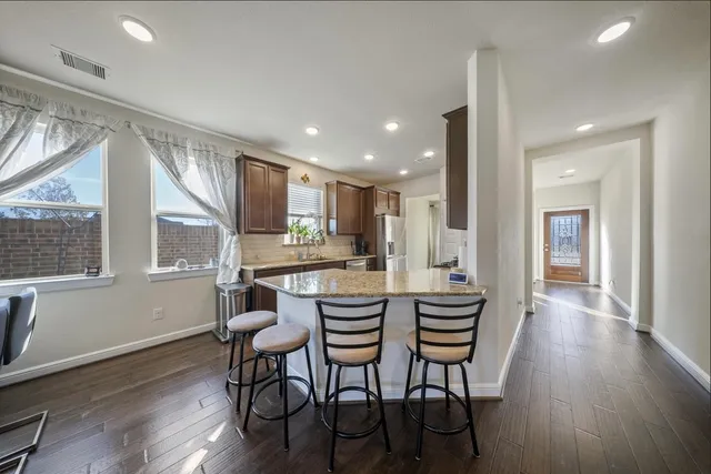 a kitchen with a table and chairs in it