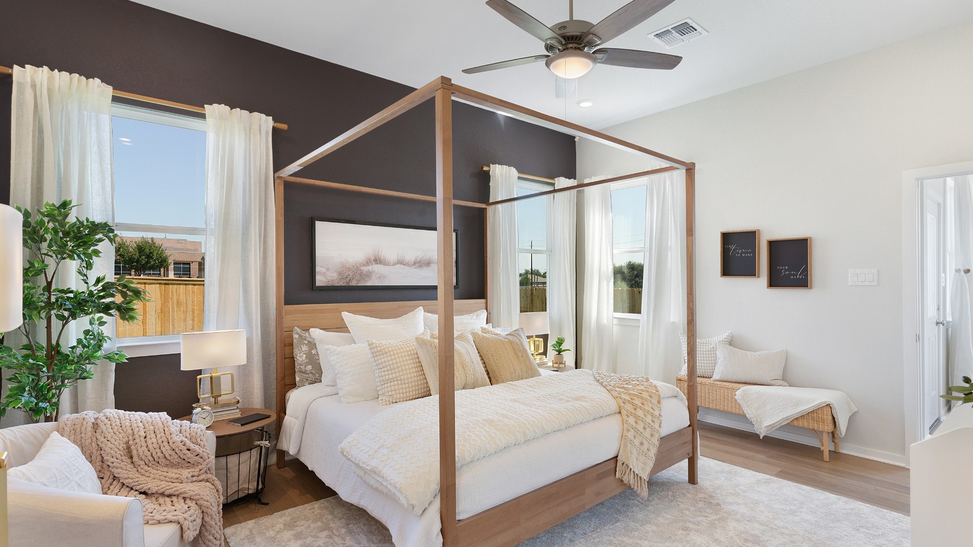25812 Jasmine Sprig Lane Elgin, TX 78621 - Photo 11 of 33 Natural light floods this primary bedroom featuring a vaulted ceiling and a classic four-poster bed frame.