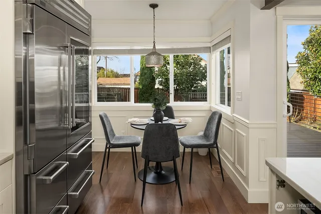 a view of a dining room with furniture window and wooden floor