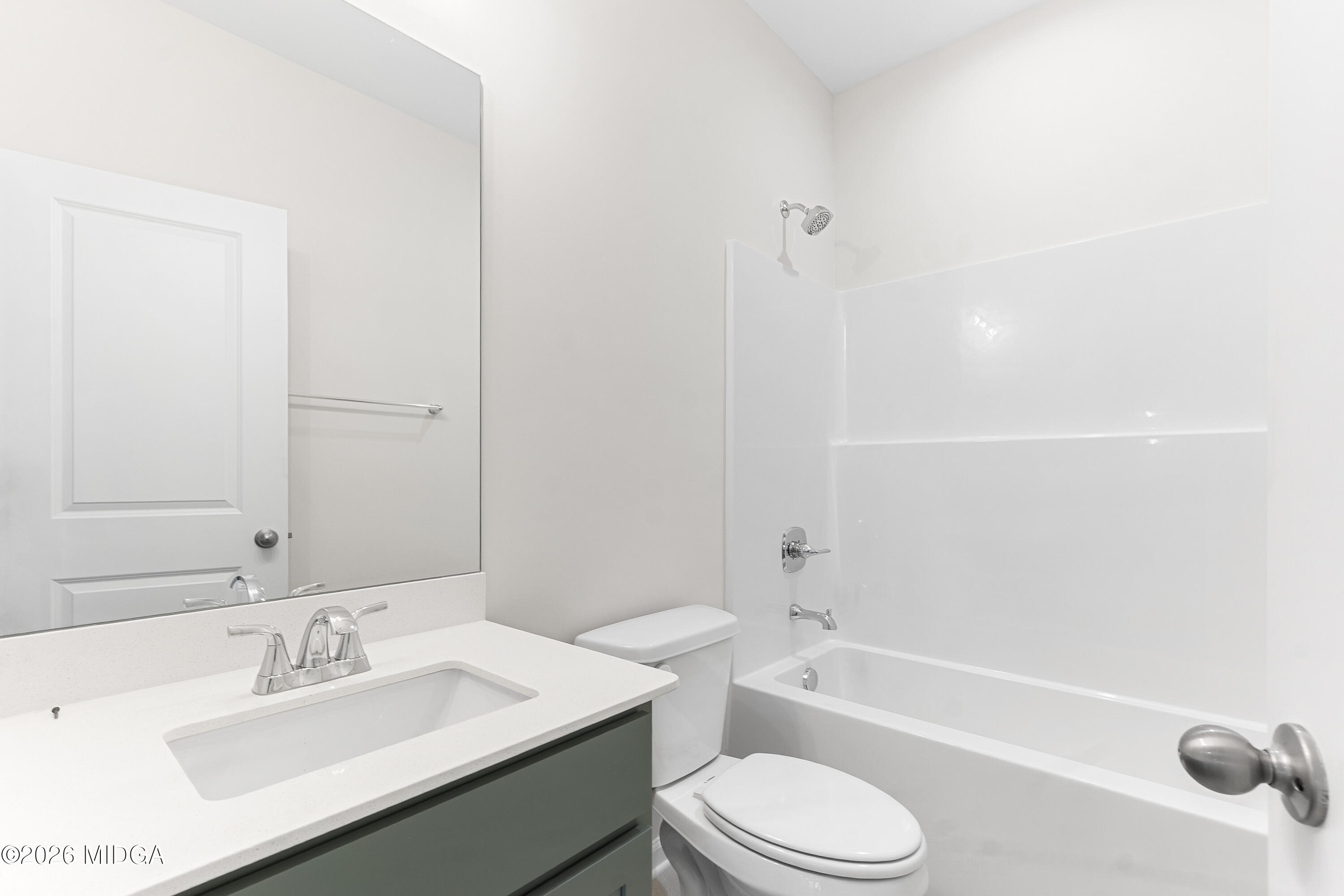 5393 Felles Way, Unit 359 Forsyth, GA 31029 - Photo 26 of 54 a bathroom with a sink a toilet and shower