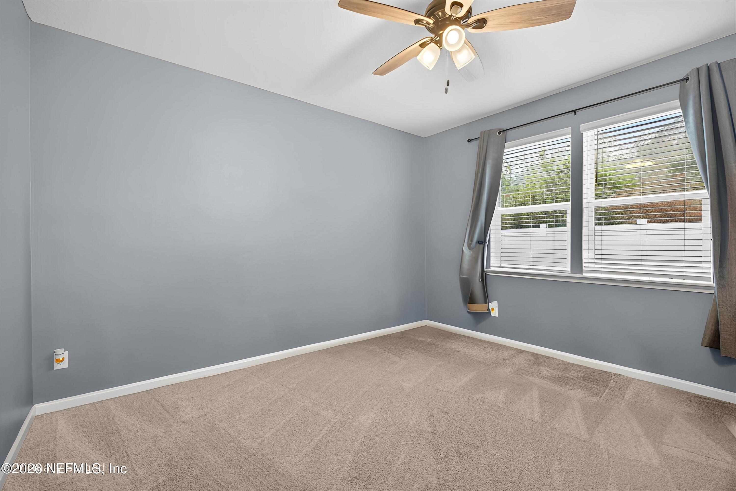 1062 Persimmon Drive Middleburg, FL 32068 - Photo 27 of 45 a view of an empty room with a window