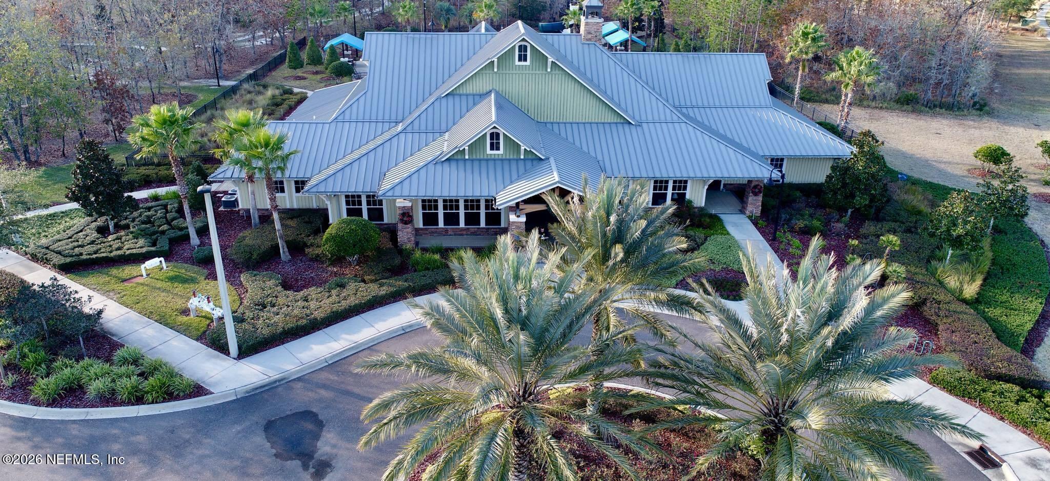1062 Persimmon Drive Middleburg, FL 32068 - Photo 38 of 45 a view of a house with a small yard plants and large tree