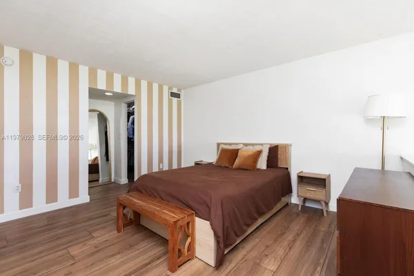 a bedroom with a bed and a table