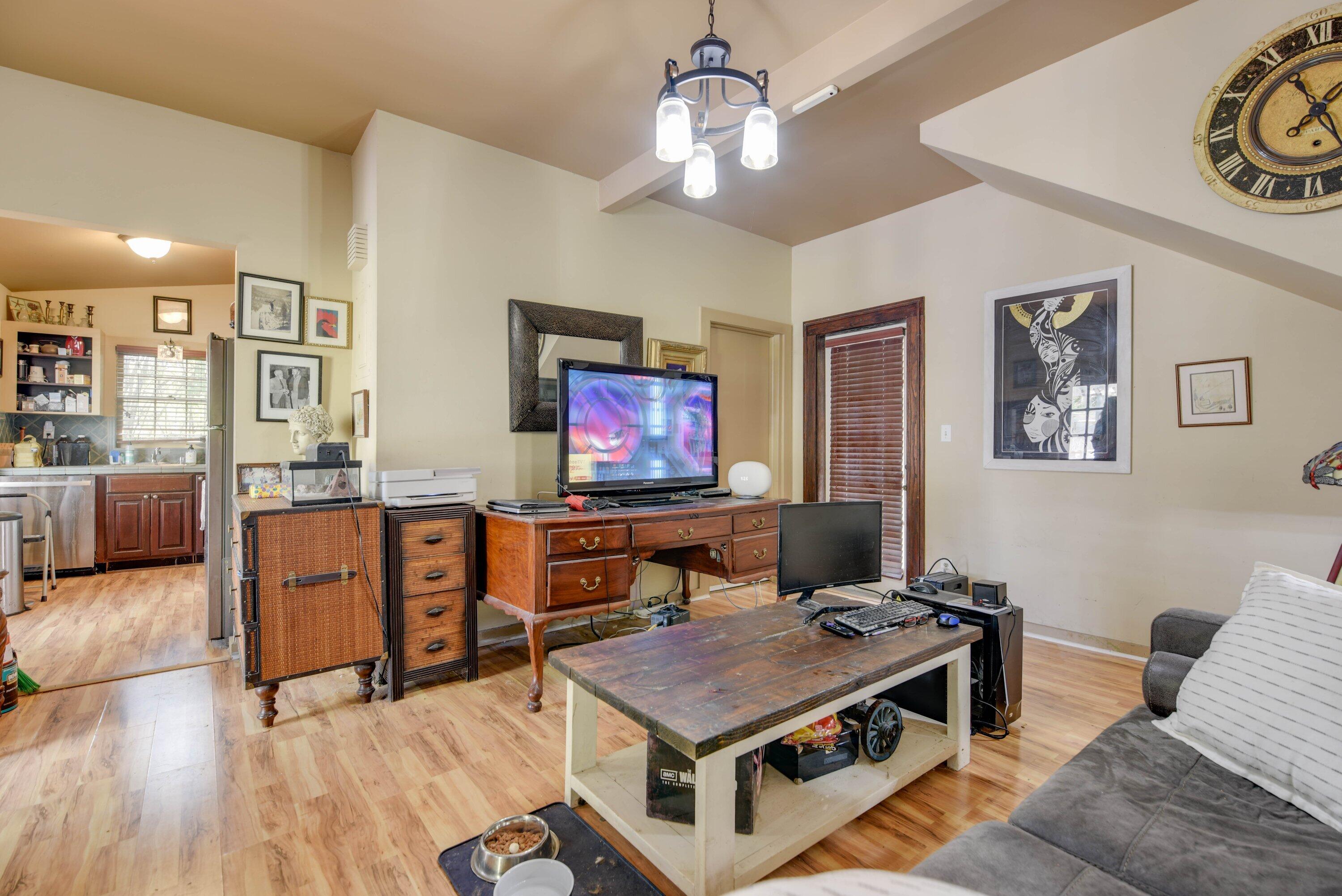 1306 Virginia Street Key West, FL 33040 - Photo 20 of 30 a living room with furniture a flat screen tv and kitchen view