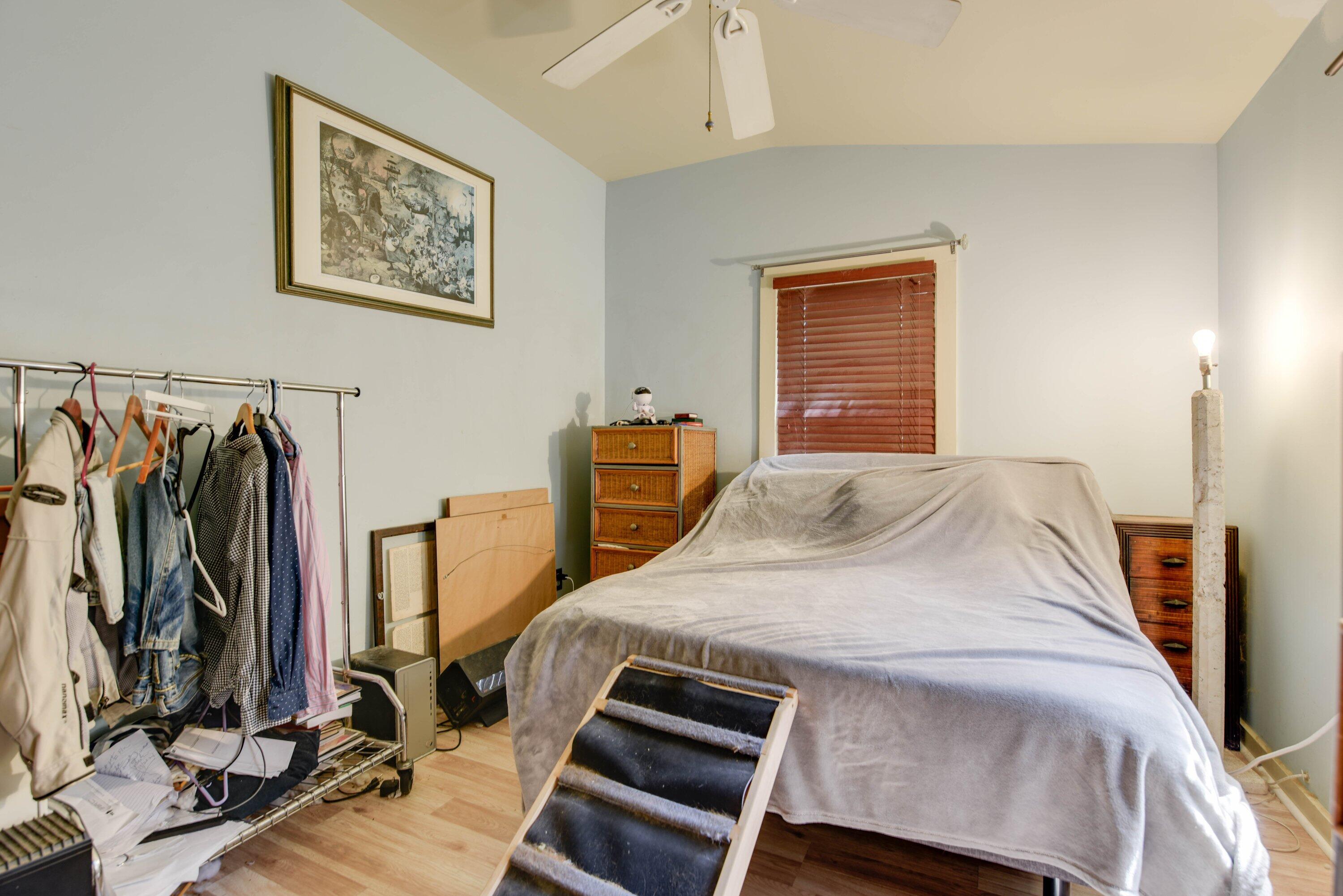 1306 Virginia Street Key West, FL 33040 - Photo 21 of 30 a bedroom with a bed and a tv