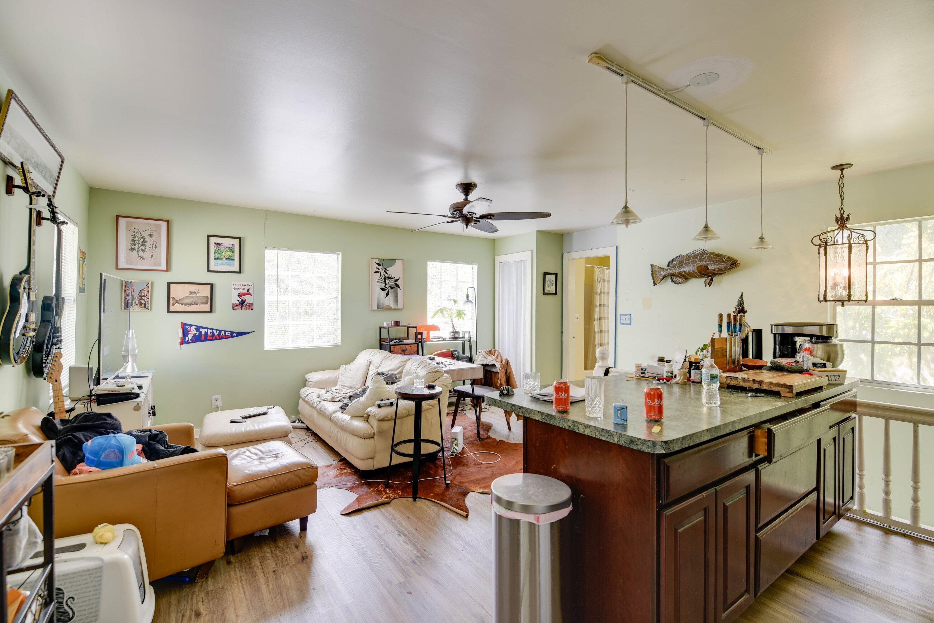 1306 Virginia Street Key West, FL 33040 - Photo 25 of 30 a living room with furniture and a chandelier