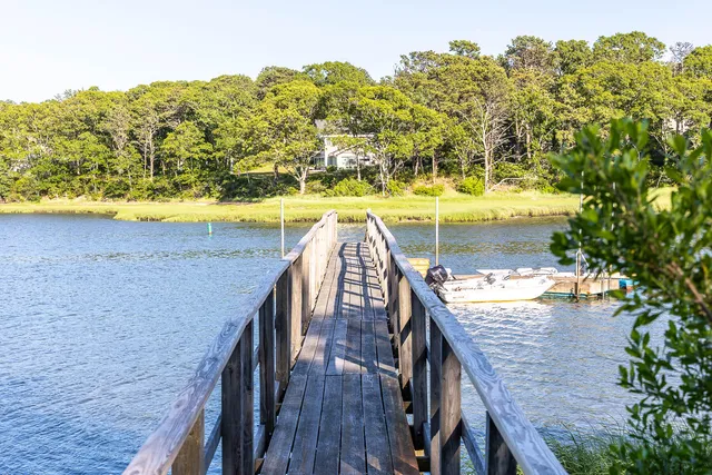 a view of swimming pool with outdoor seating and wooden floor