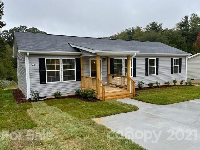 1471 Howard Gap Loop Road Flat Rock, NC 28731 - Photo 2 of 24 a view of a house with a yard