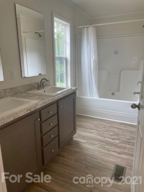 1471 Howard Gap Loop Road Flat Rock, NC 28731 - Photo 16 of 24 a bathroom with a sink and a mirror