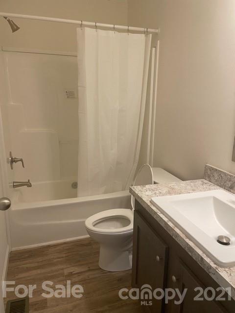 1471 Howard Gap Loop Road Flat Rock, NC 28731 - Photo 22 of 24 a bathroom with a granite countertop sink toilet and shower