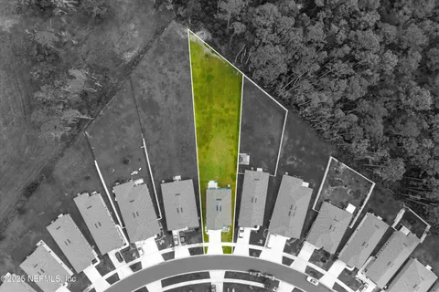 an aerial view of a house with a swimming pool yard and outdoor seating