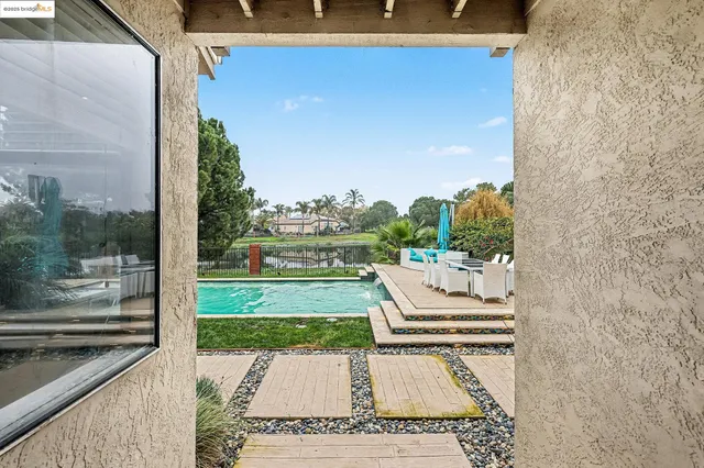 a view of a patio with a yard