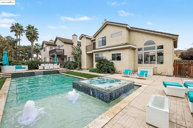 a front view of house with yard and outdoor seating
