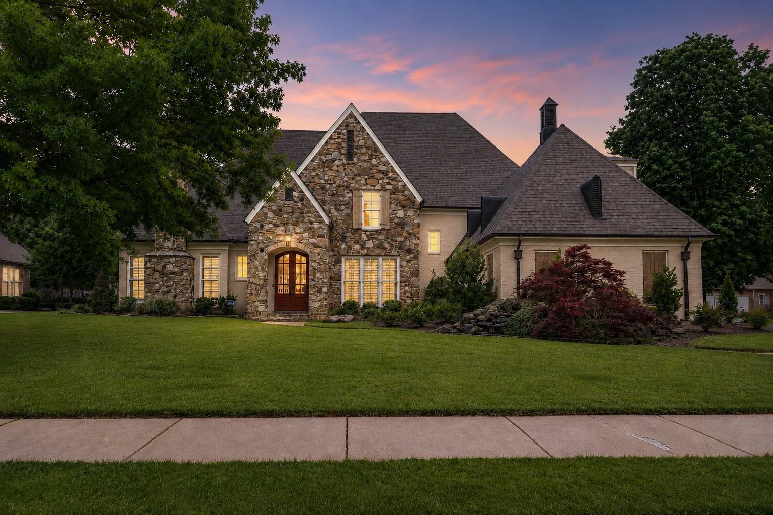 a front view of a house with a yard