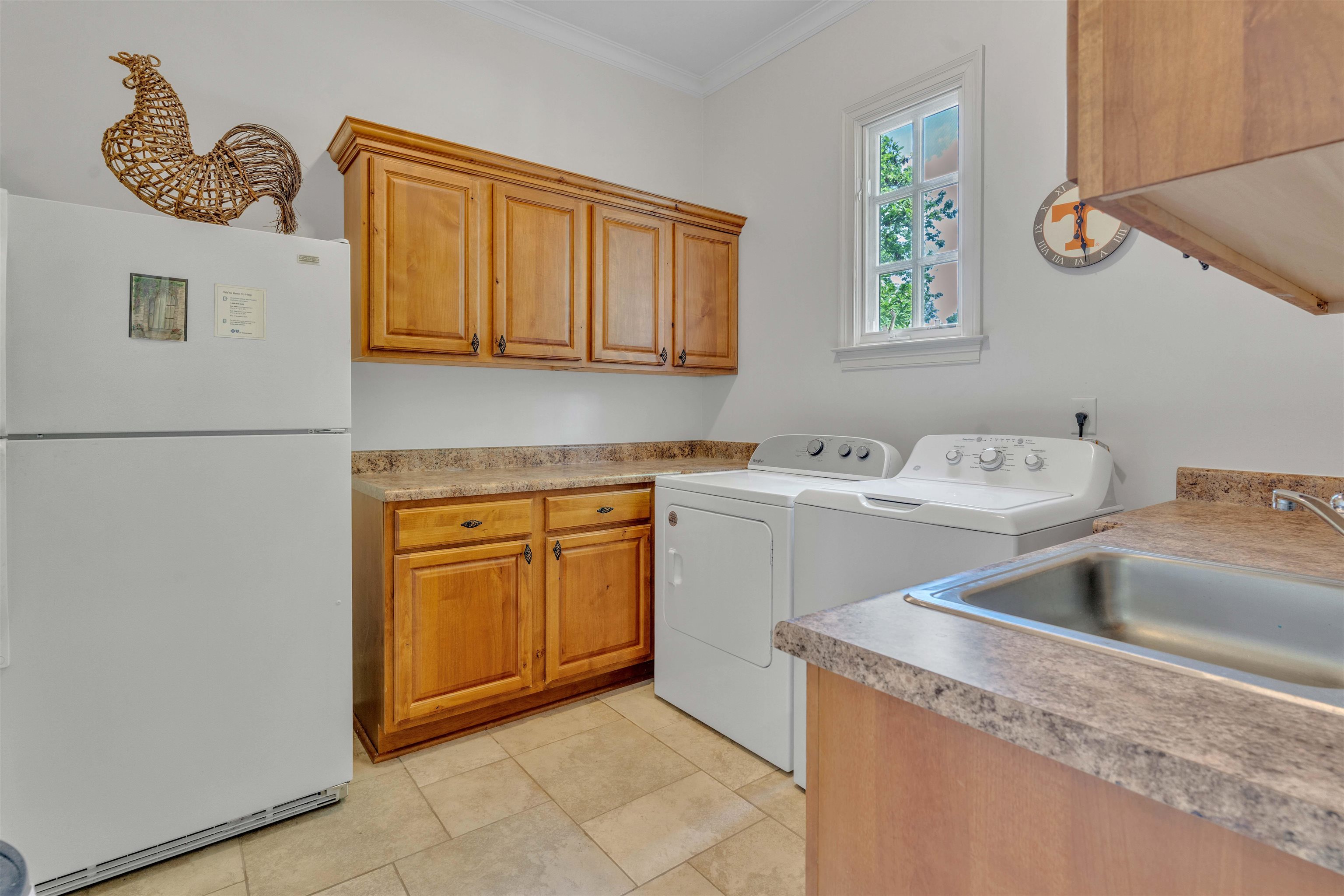 1218 Braystone Trail Collierville, TN 38017 - Photo 16 of 40 a utility room with a sink a washer and dryer