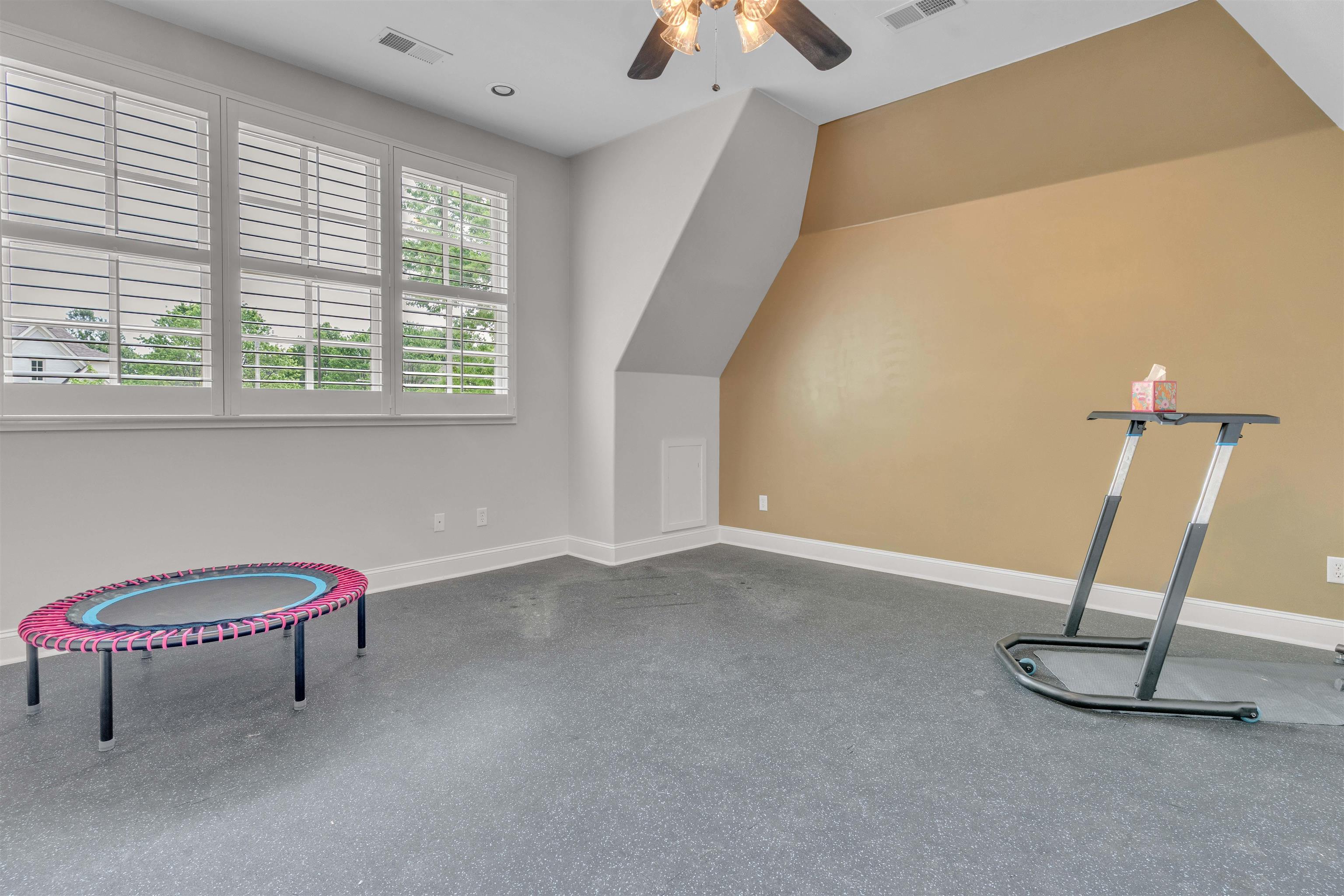 1218 Braystone Trail Collierville, TN 38017 - Photo 29 of 40 a view of a room with gym equipment and a window