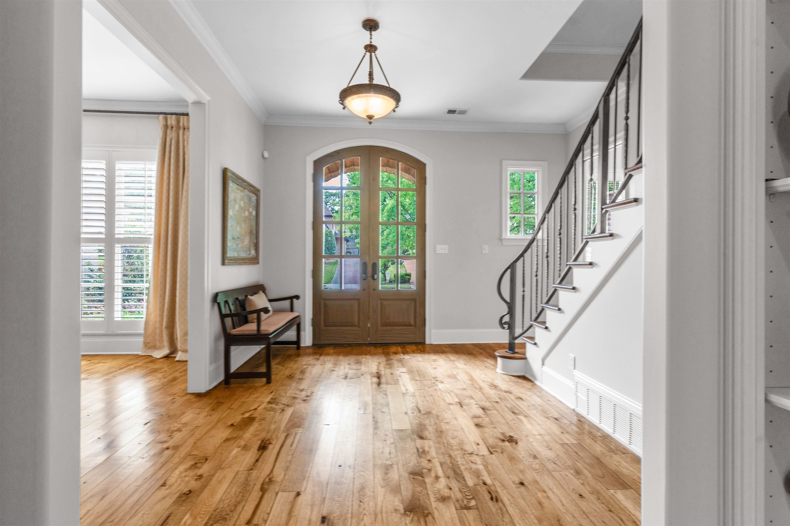 1218 Braystone Trail Collierville, TN 38017 - Photo 3 of 40 Foyer entrance with light wood-style flooring, french doors, and crown molding