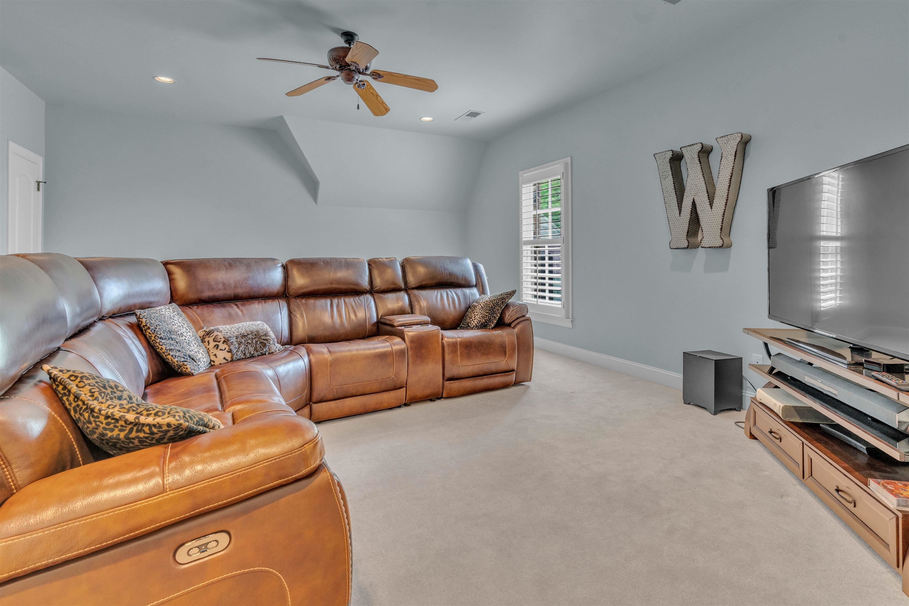1218 Braystone Trail Collierville, TN 38017 - Photo 32 of 40 a living room with furniture and a flat screen tv
