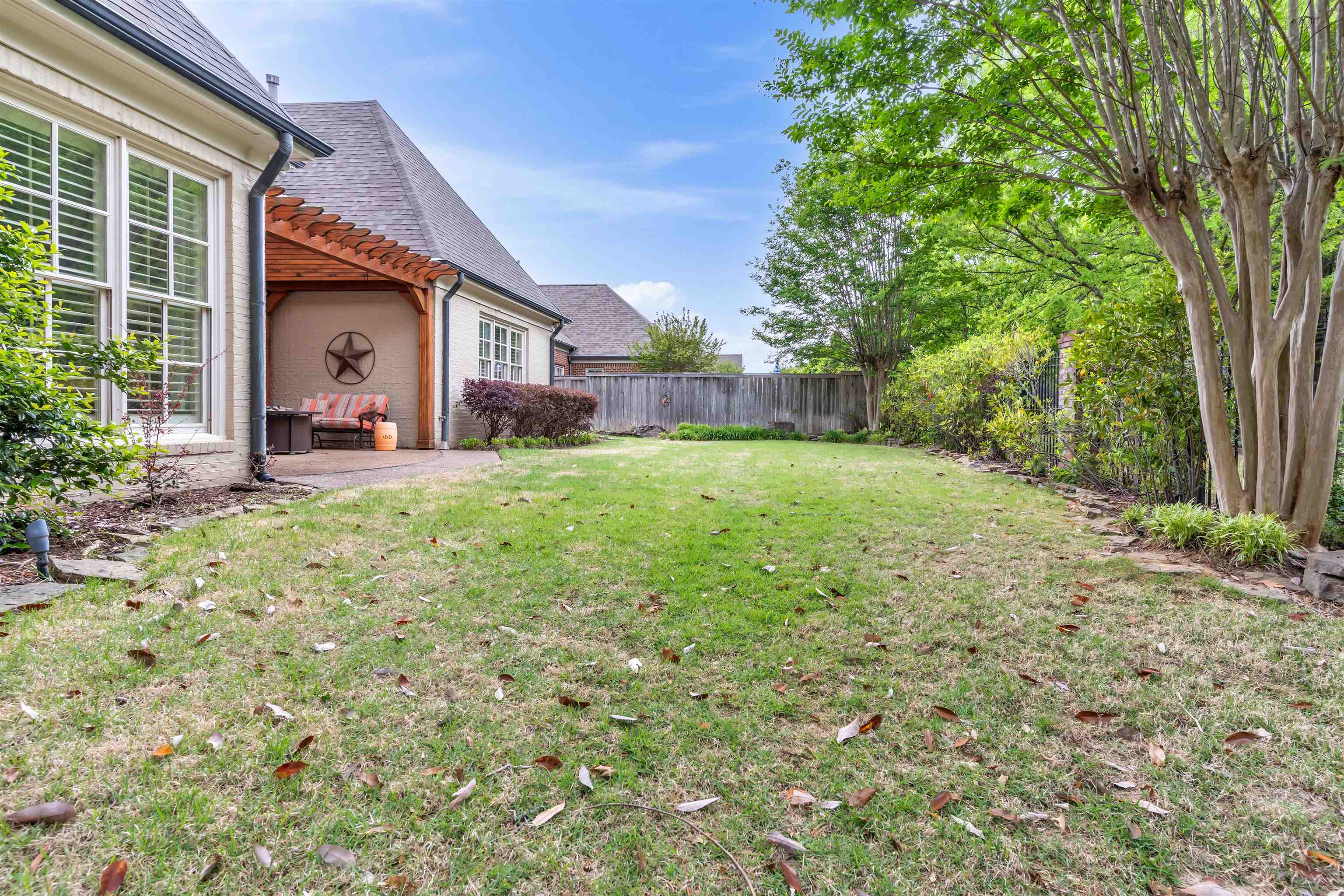 1218 Braystone Trail Collierville, TN 38017 - Photo 34 of 40 Generous lawn area with established greenery and mature trees