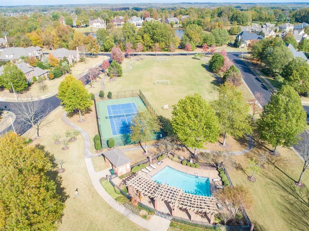 1218 Braystone Trail Collierville, TN 38017 - Photo 38 of 40 Community amenities featuring a swimming pool with pergola, tennis court, and expansive green space