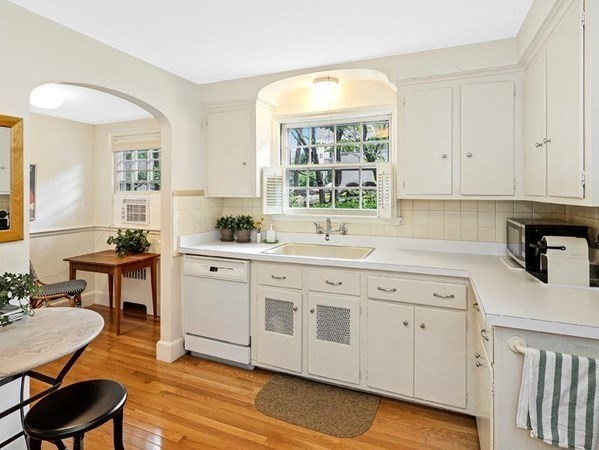 8 Monadnock Road Arlington, MA 02476 - Photo 12 of 36 a kitchen with a sink cabinets and window