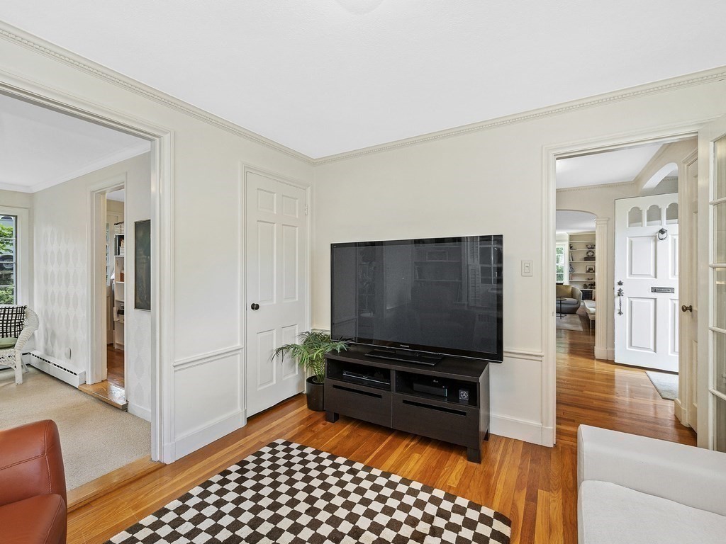 8 Monadnock Road Arlington, MA 02476 - Photo 18 of 36 a living room with furniture and a flat screen tv