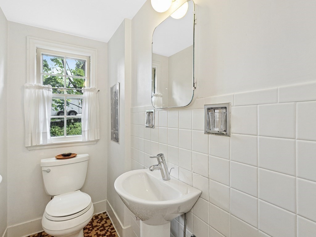 8 Monadnock Road Arlington, MA 02476 - Photo 19 of 36 a bathroom with a toilet sink and mirror