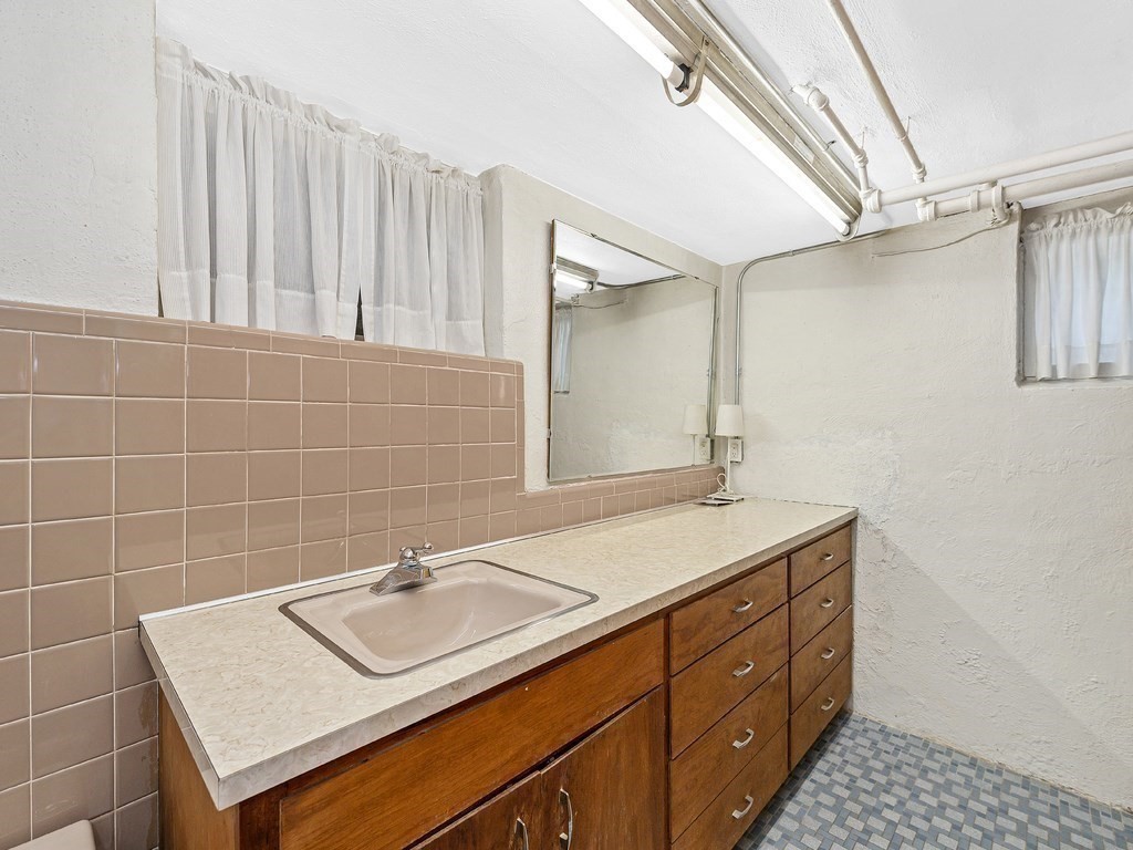 8 Monadnock Road Arlington, MA 02476 - Photo 29 of 36 a bathroom with a sink and a mirror