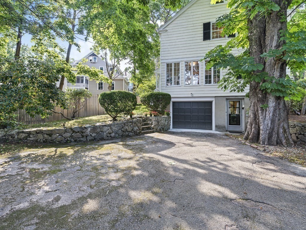 8 Monadnock Road Arlington, MA 02476 - Photo 34 of 36 a front view of a house with a yard and a garage