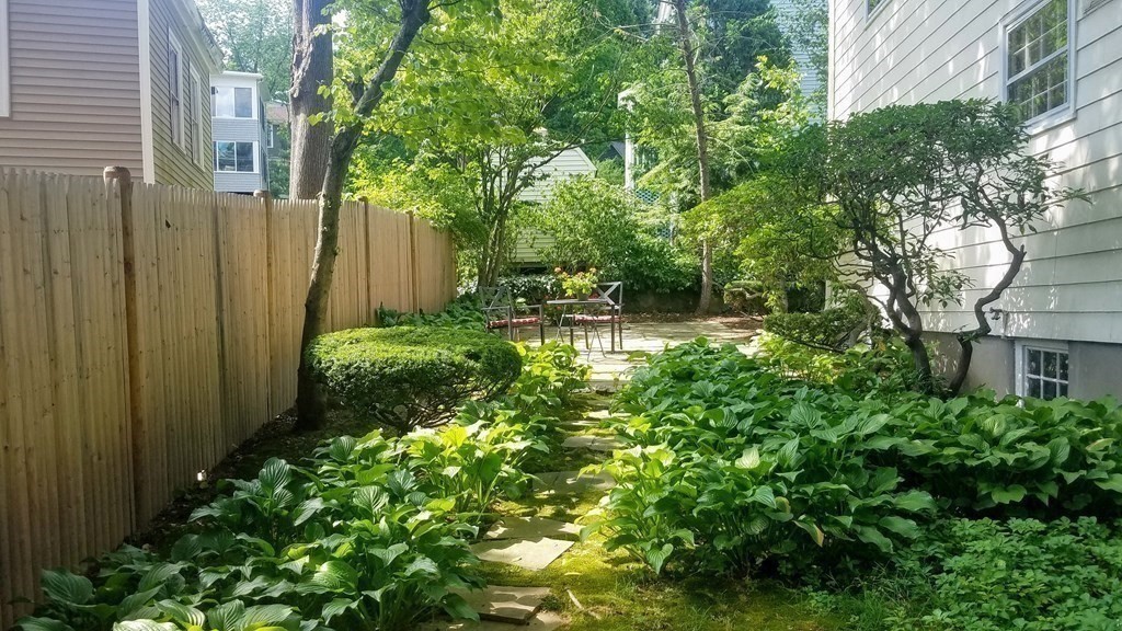 8 Monadnock Road Arlington, MA 02476 - Photo 35 of 36 a backyard of a house with lots of green space