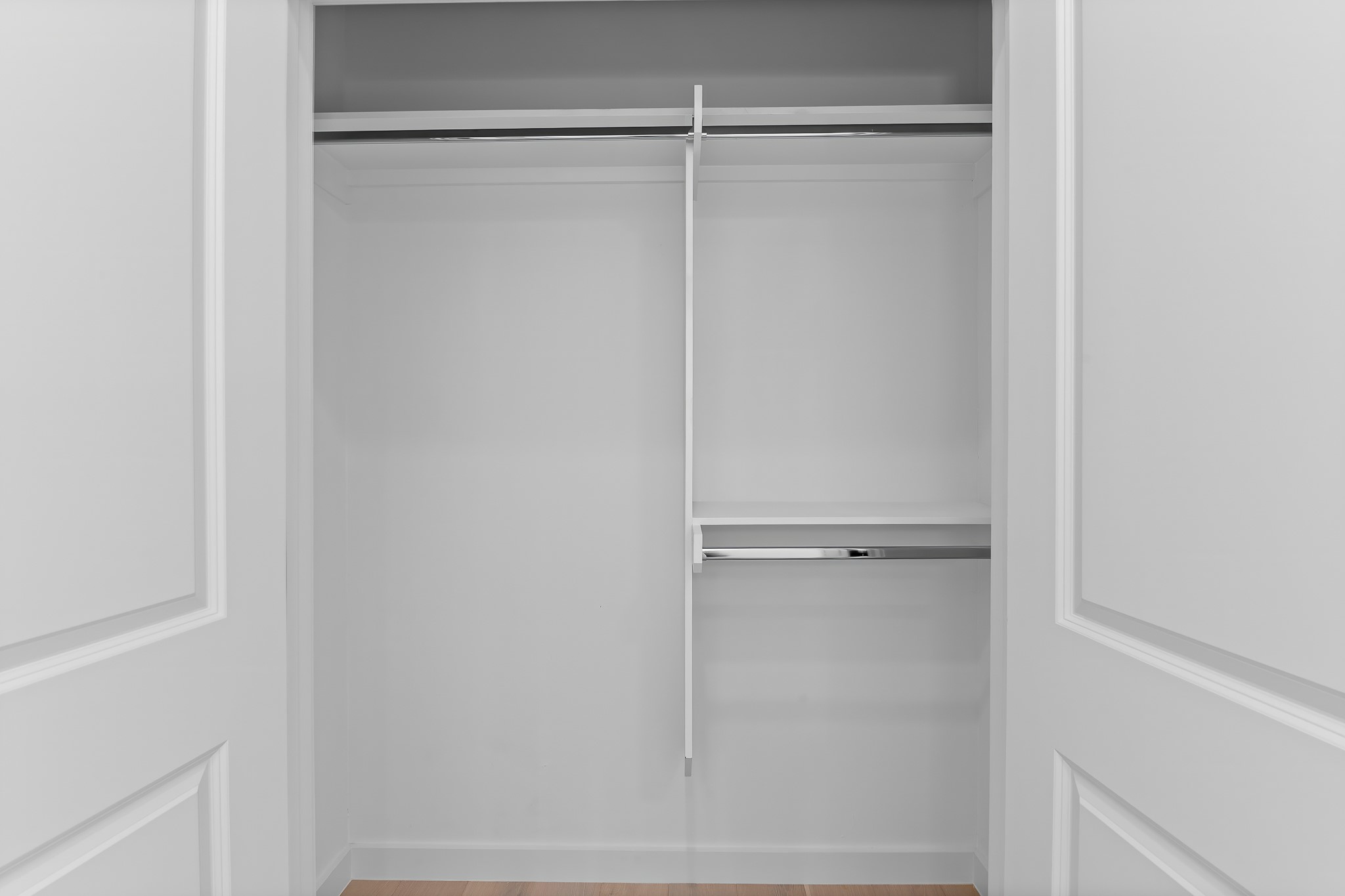 5305 Ledesma Road, Unit 4 Austin, TX 78721 - Photo 25 of 40 Ample storage solutions await in this well-appointed closet, featuring sturdy hanging rods and convenient shelving.