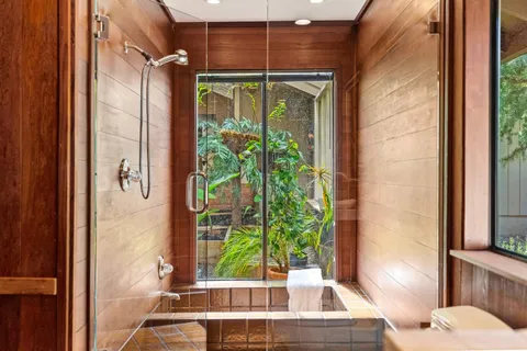 a kitchen with stainless steel appliances granite countertop a refrigerator and a stove