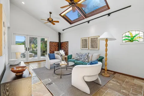 a workspace with furniture and window