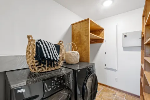 a bedroom with bed and a window