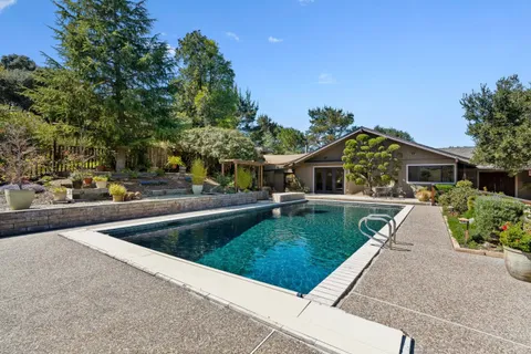 a outdoor space with chairs and deck