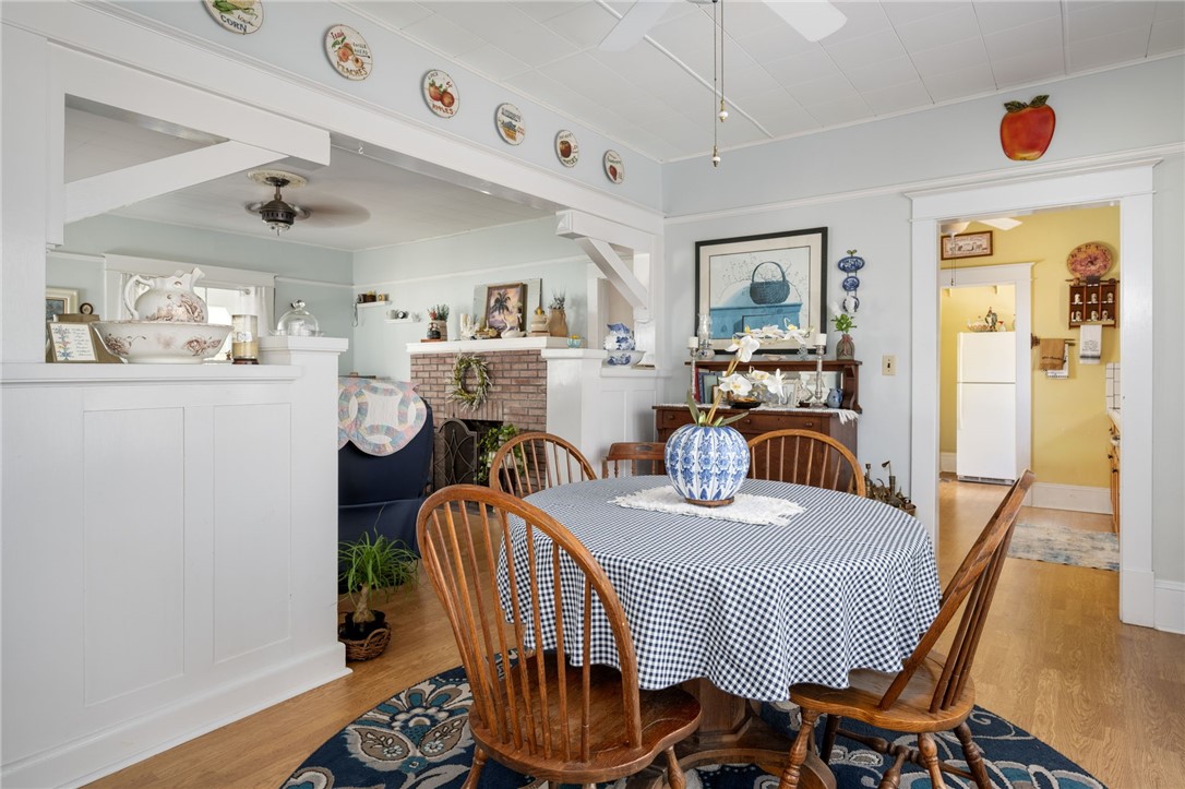 9115 Highway 1 Sebastian, FL 32958 - Photo 11 of 34 a dining room with furniture wooden floor a rug and a painting