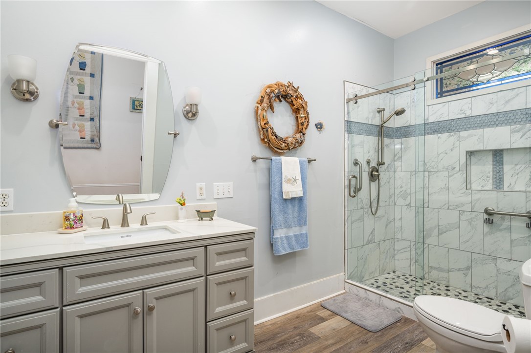 9115 Highway 1 Sebastian, FL 32958 - Photo 21 of 34 a bathroom with a sink a toilet and shower