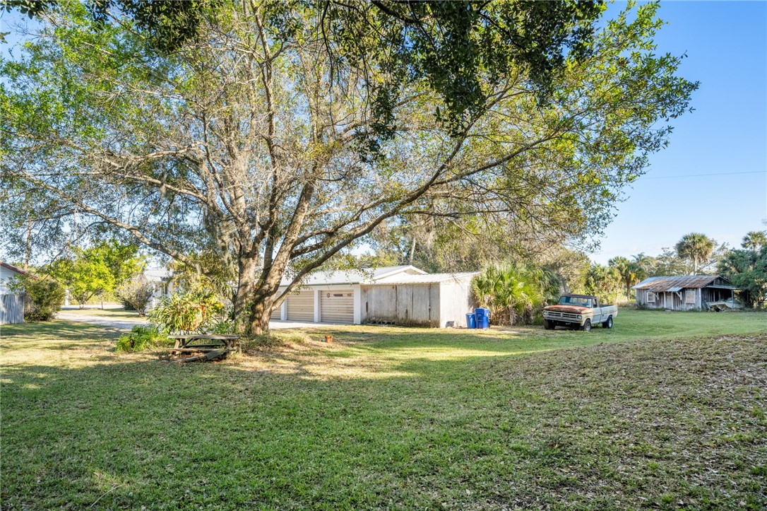 9115 Highway 1 Sebastian, FL 32958 - Photo 30 of 34 a view of yard with swimming pool and trees