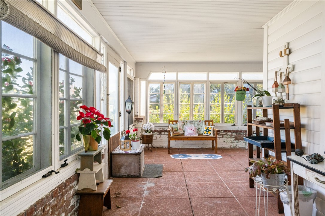 9115 Highway 1 Sebastian, FL 32958 - Photo 6 of 34 a living room filled with furniture and a potted plant