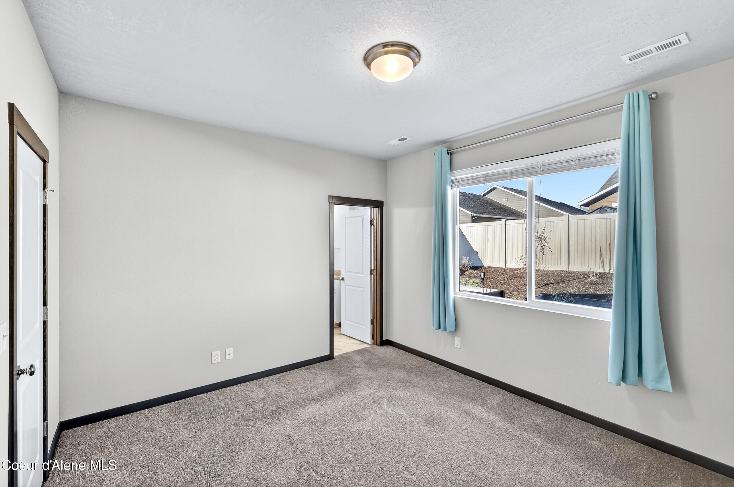 193 Inkwood Street Post Falls, ID 83854 - Photo 29 of 54 027_Primary Bedroom