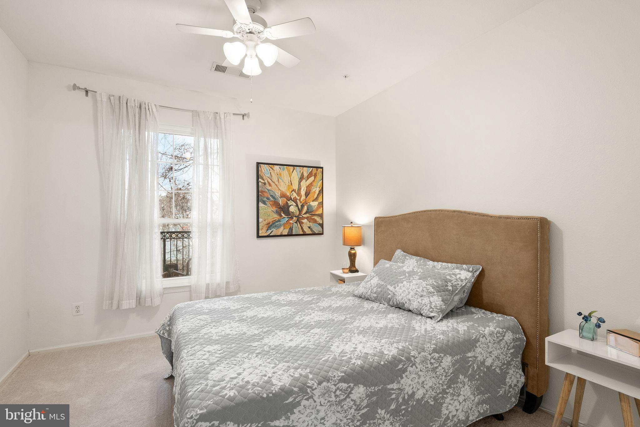 1601 Spring Gate Dr., Unit 1116 McLean, VA 22102 - Photo 17 of 26 a bedroom with a bed and a window