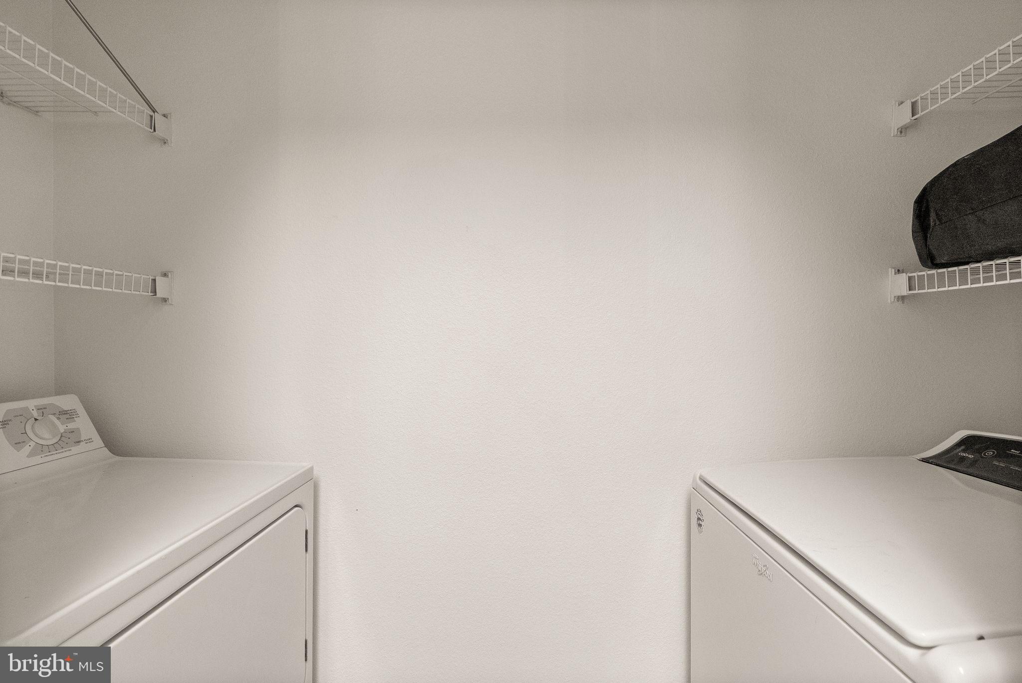 1601 Spring Gate Dr., Unit 1116 McLean, VA 22102 - Photo 23 of 26 a utility room with dryer and washer
