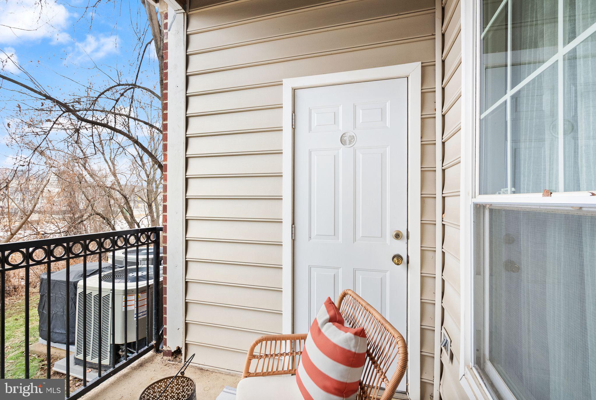 1601 Spring Gate Dr., Unit 1116 McLean, VA 22102 - Photo 26 of 26 a view of a porch with wooden floor and fence