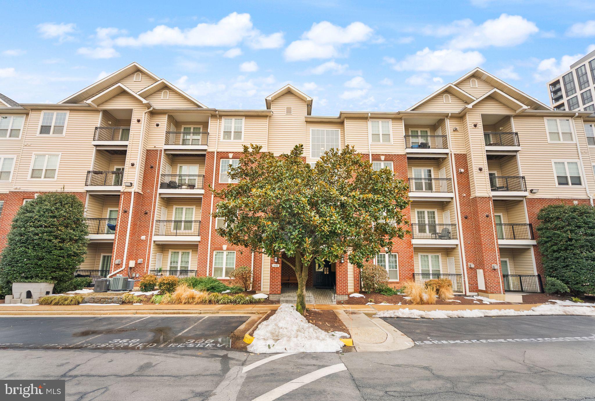 1601 Spring Gate Dr., Unit 1116 McLean, VA 22102 - Photo 5 of 26 front view of a large building