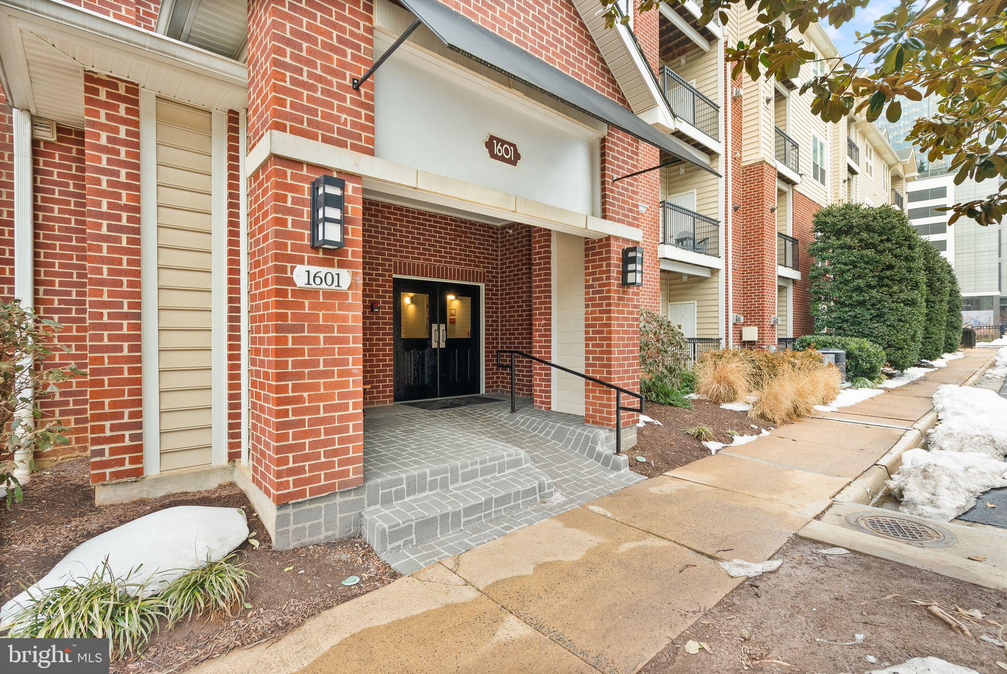 1601 Spring Gate Dr., Unit 1116 McLean, VA 22102 - Photo 10 of 26 a front view of a building with garage