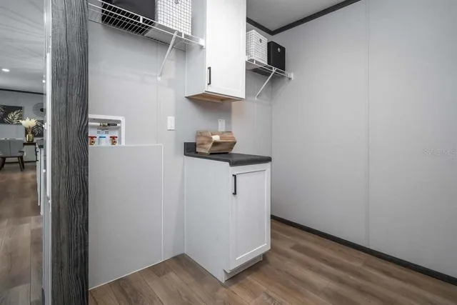 a view of storage and utility room with closet